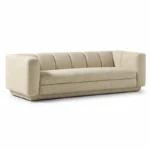 Cream boucle The Plinth Premium Sofa with rounded arms, channel backrest, and low modern base on a white background.