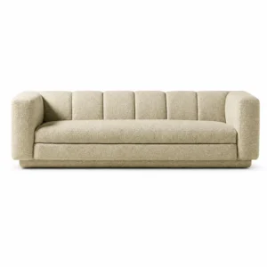 Front view of The Plinth Premium Sofa in cream boucle fabric with rounded arms, channel backrest, and low upholstered base.